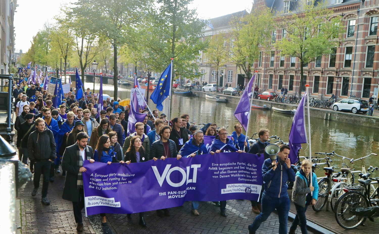 Volt parade in Amsterdam with flag